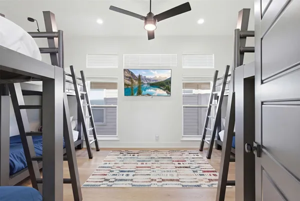 a view of a hallway with wooden floor and stairs
