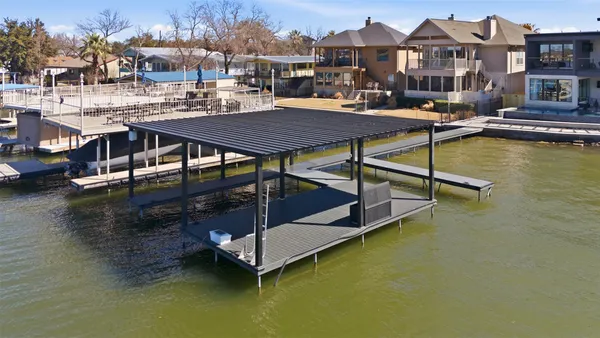 a view of a swimming pool with a table and chairs