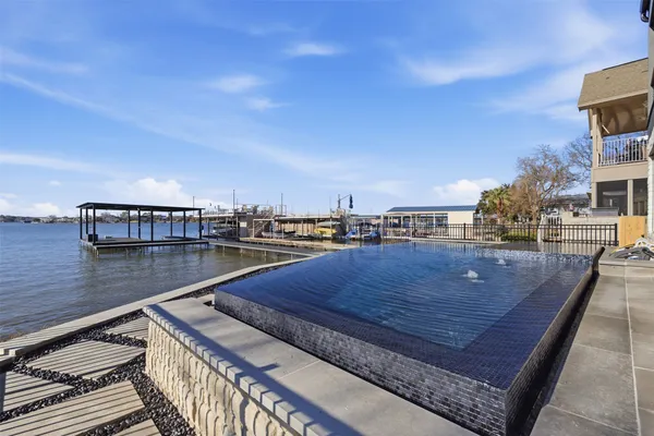a view of swimming pool with outdoor seating