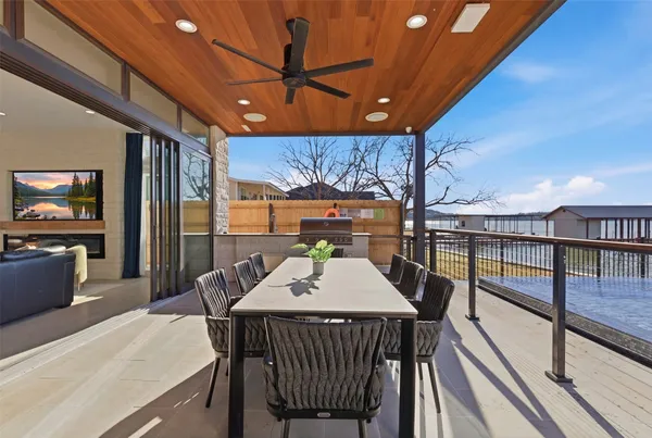 a view of a patio with a table and chairs