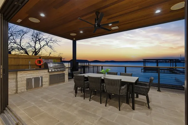 a view of a terrace with furniture and garden