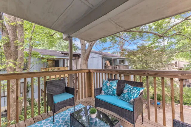 a view of a two chairs in the deck