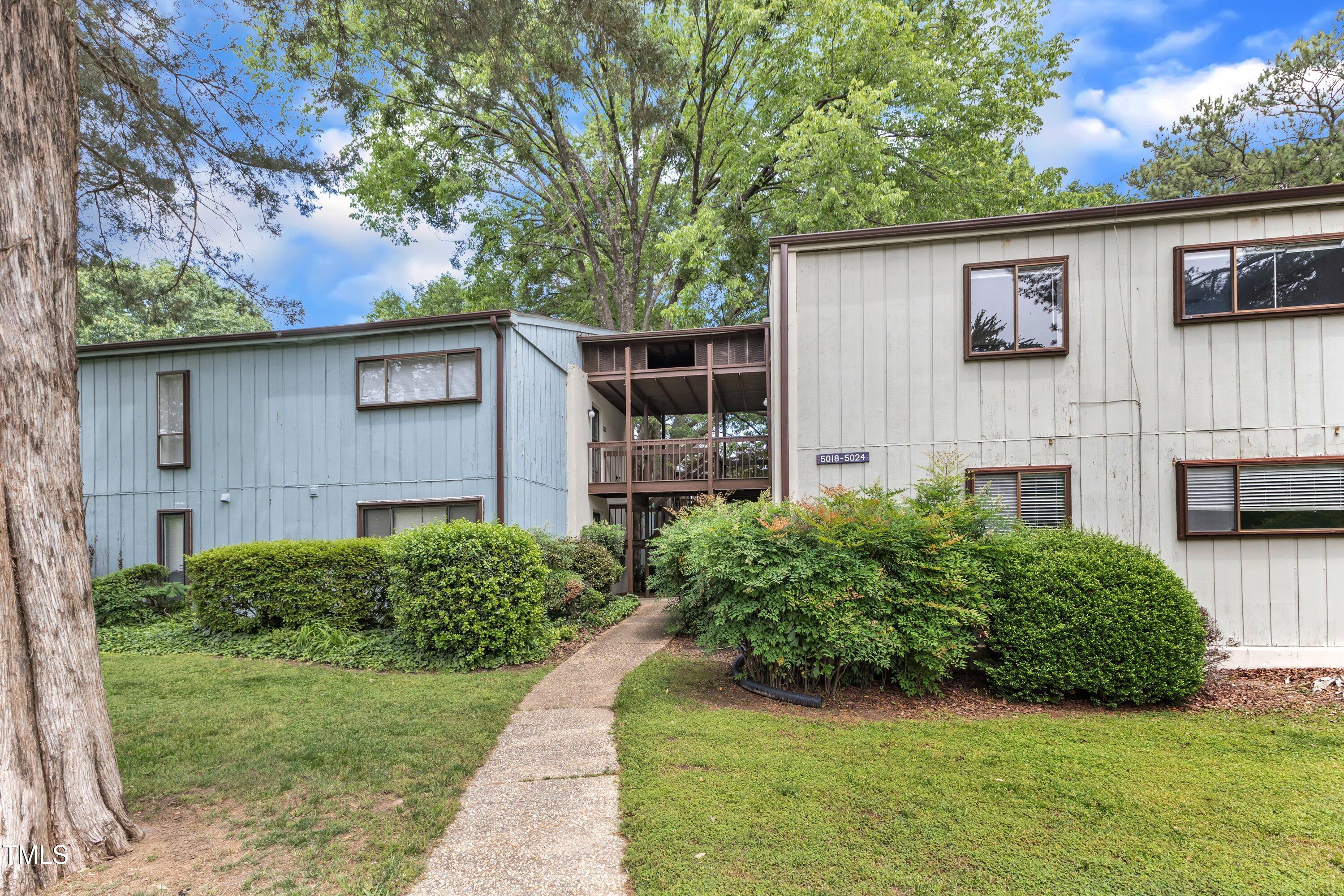 5022 Flint Ridge Place Raleigh, NC 27609 - Photo 29 of 32 a view of a house with a yard