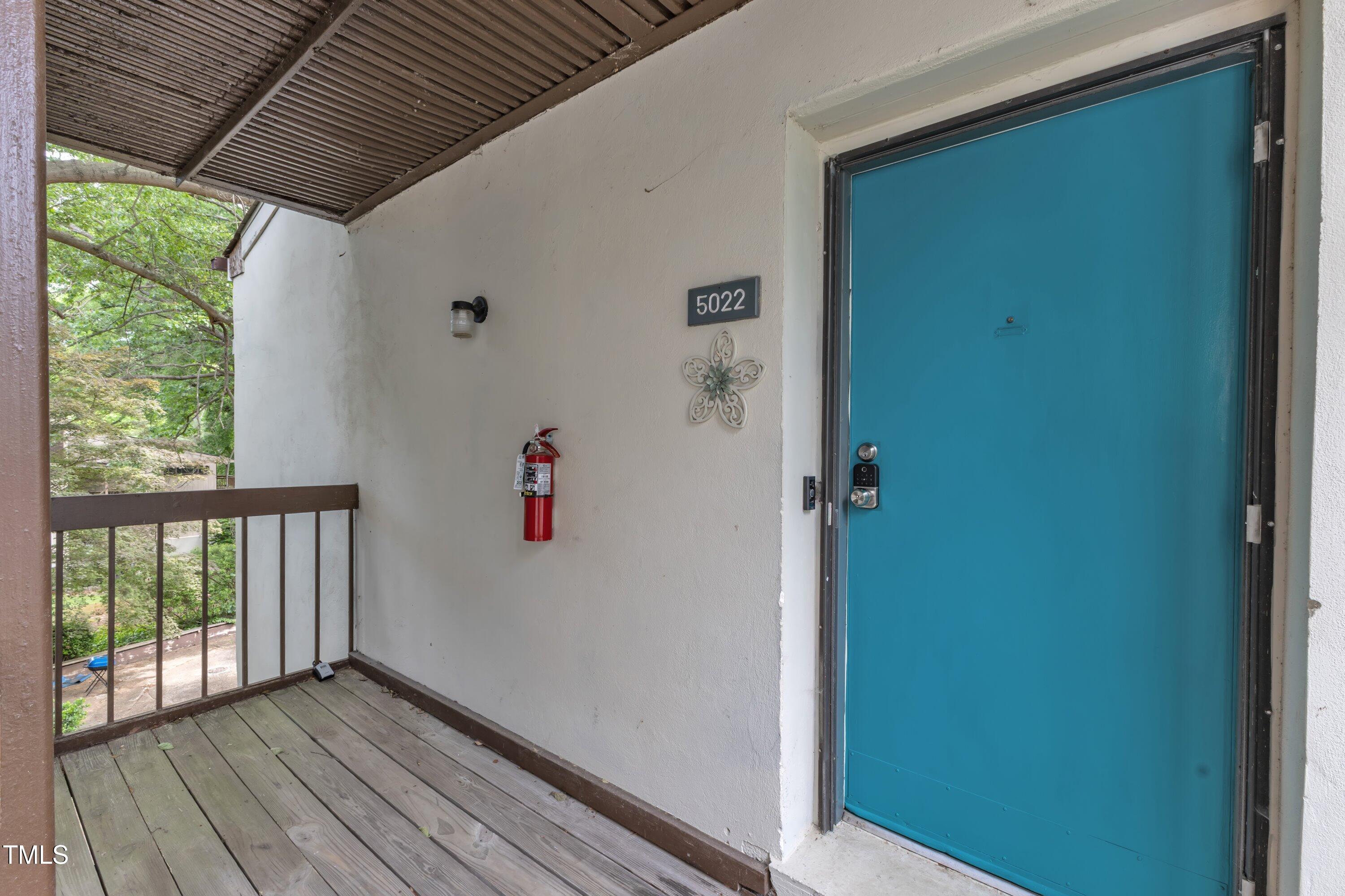 5022 Flint Ridge Place Raleigh, NC 27609 - Photo 32 of 32 a view of balcony with wooden floor