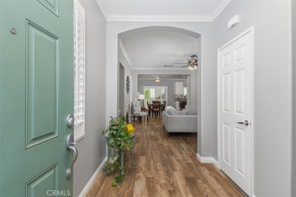 28208 Meadowsweet Drive Menifee, CA 92584 - Photo 3 of 55 a living room with furniture and a potted plant