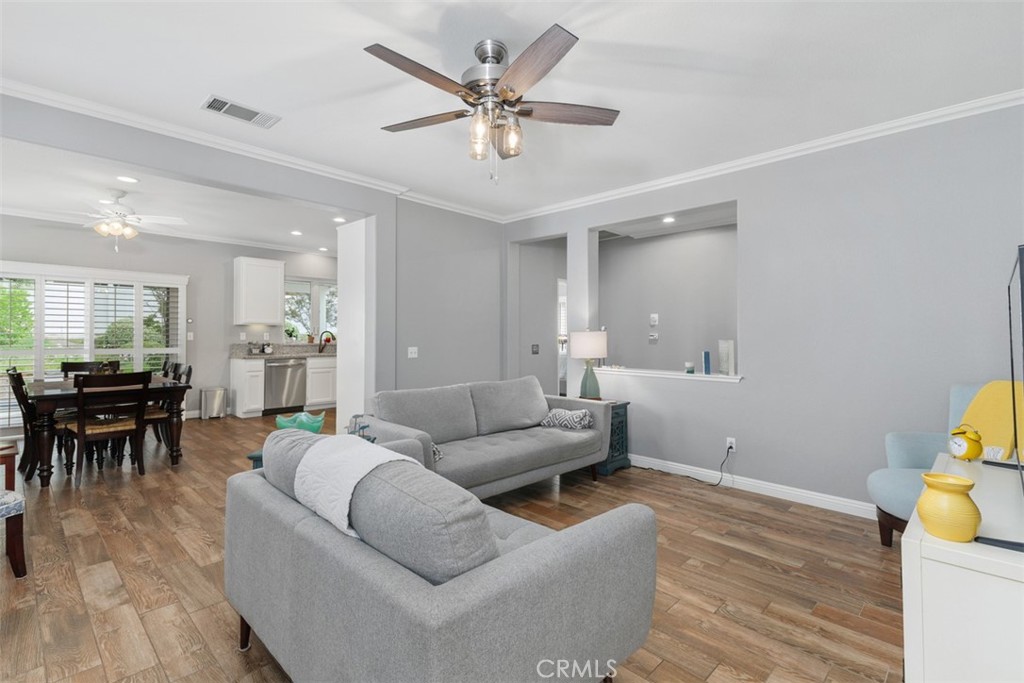 28208 Meadowsweet Drive Menifee, CA 92584 - Photo 4 of 55 a living room with furniture and kitchen view
