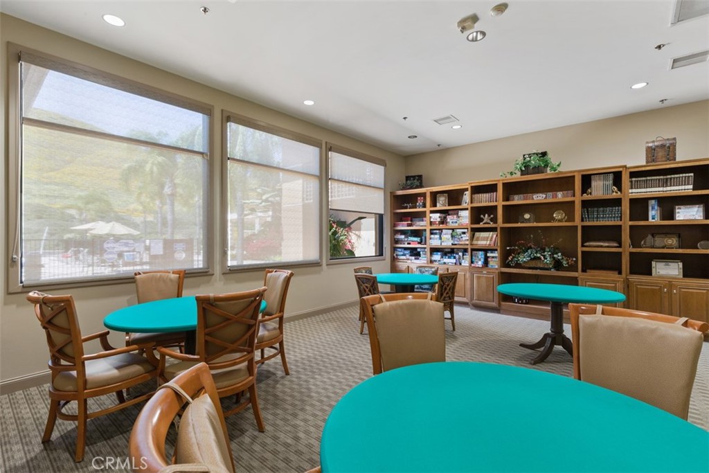 28208 Meadowsweet Drive Menifee, CA 92584 - Photo 48 of 55 a living room with furniture a rug and a large window