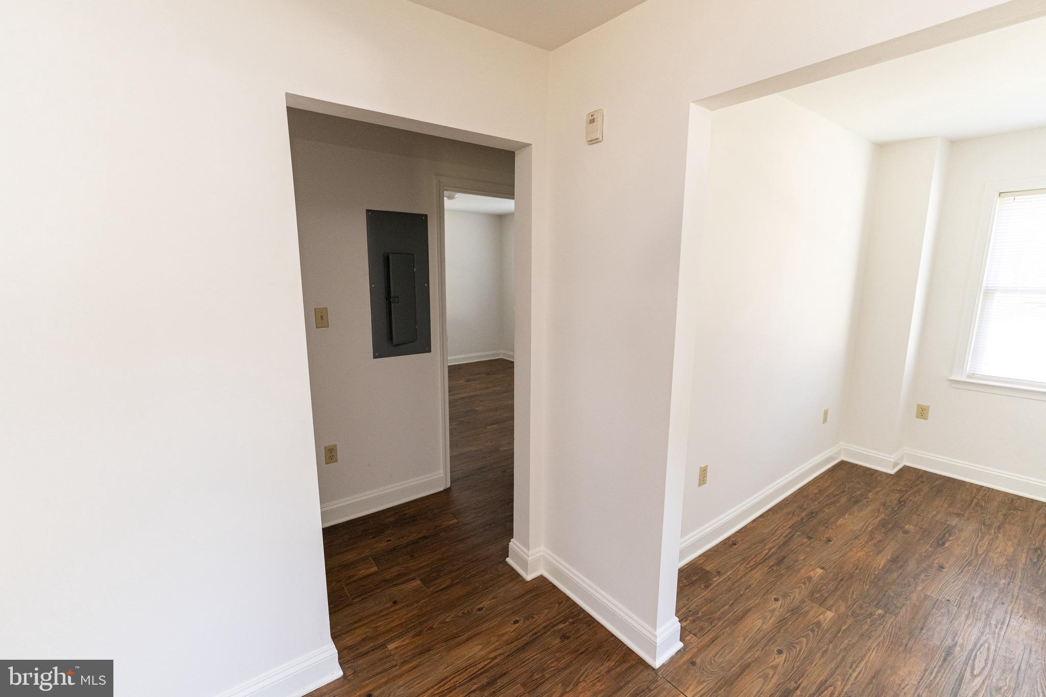 804 Travers Street, Unit 2 Cambridge, MD 21613 - Photo 14 of 26 a view of a hallway with wooden floor