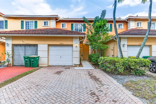 a front view of a house having yard