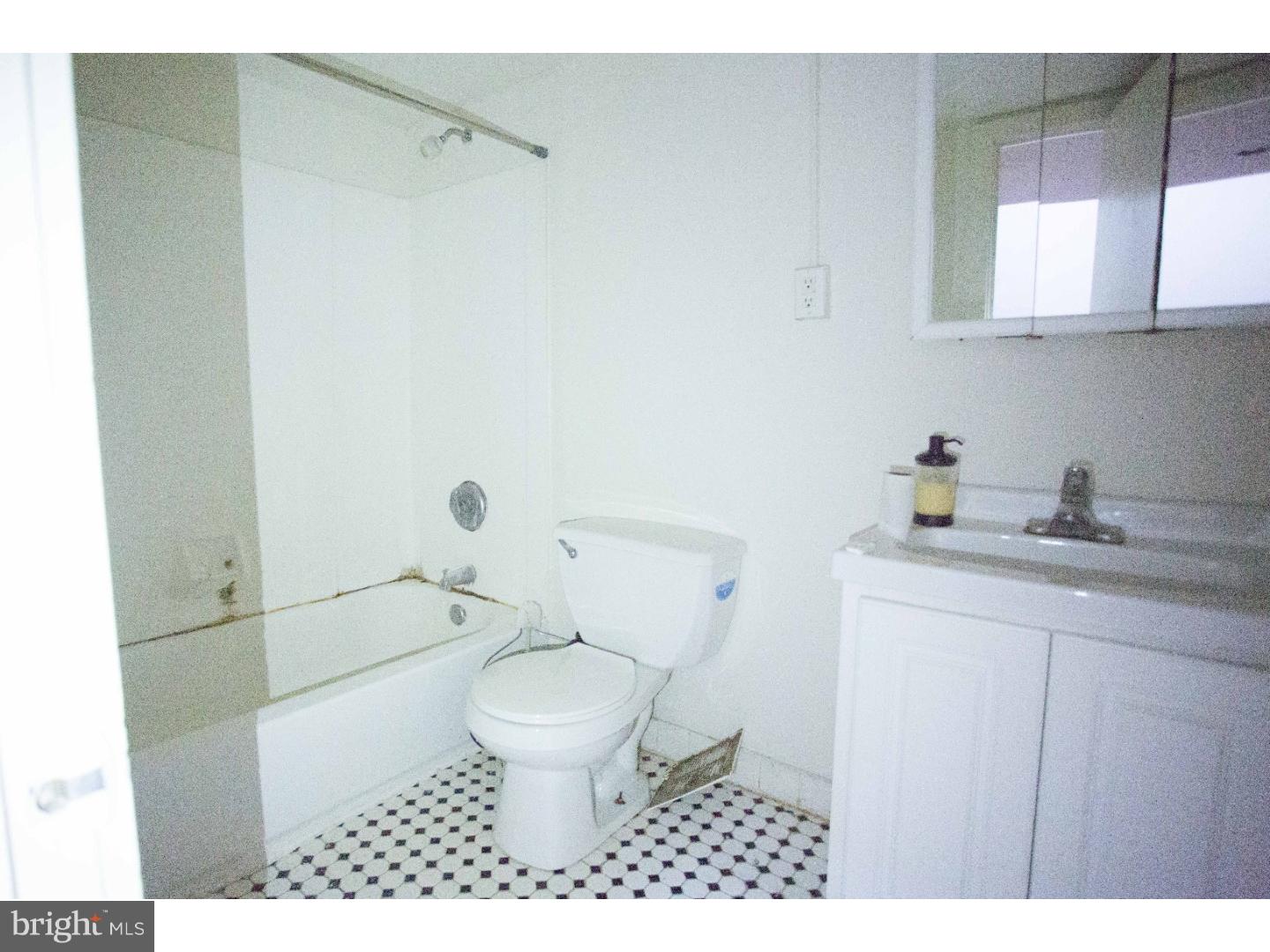 407 South 11th Street, Unit 3F Philadelphia, PA 19147 - Photo 13 of 14 a bathroom with a sink a toilet and shower