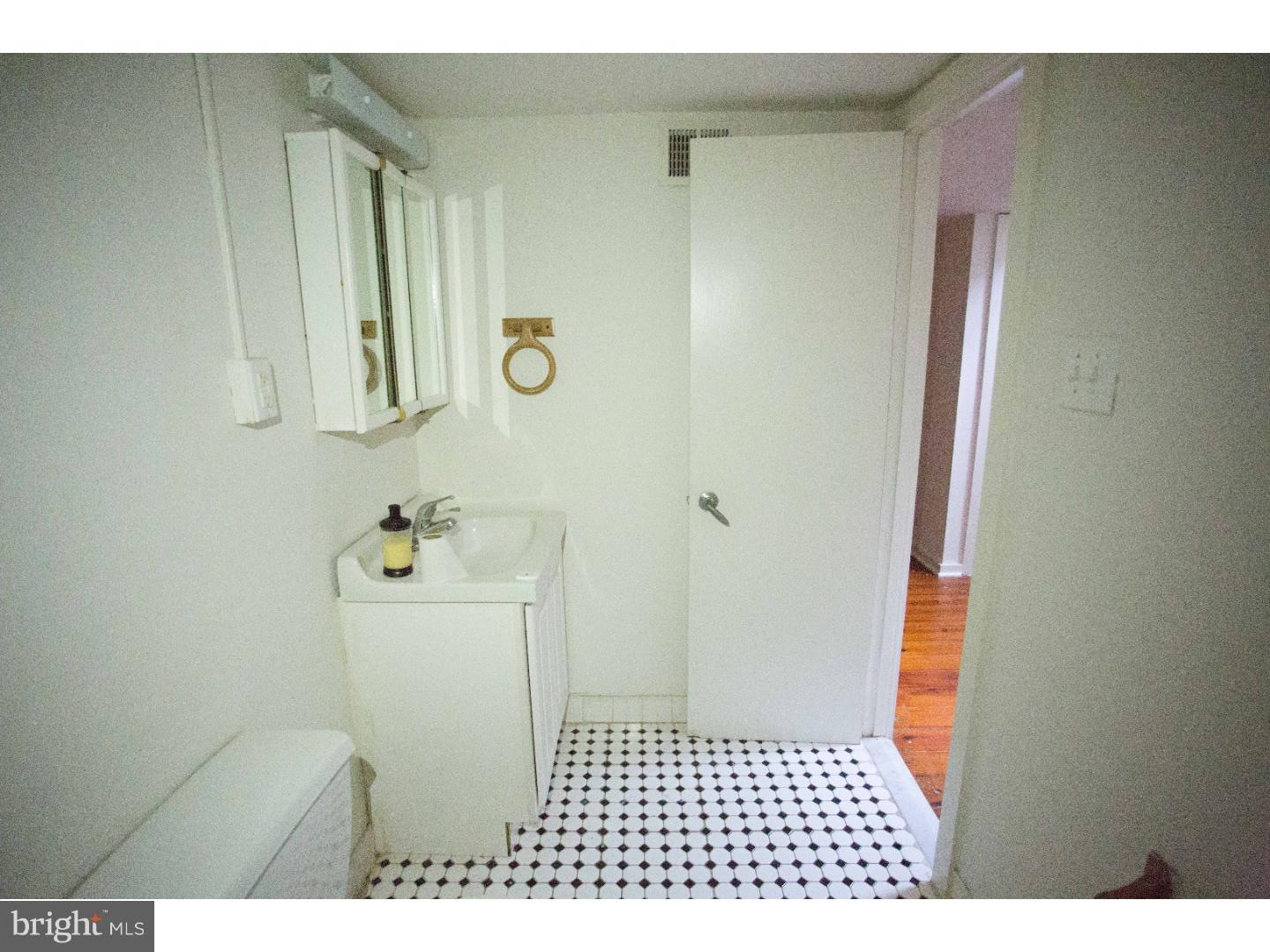407 South 11th Street, Unit 3F Philadelphia, PA 19147 - Photo 14 of 14 a bathroom with a sink a toilet and shower