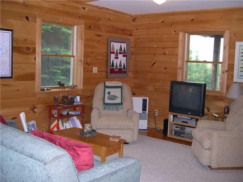 411 Birches Beach Road Oquossoc, ME 04964 - Photo 15 of 24 Living Room. Living area another view