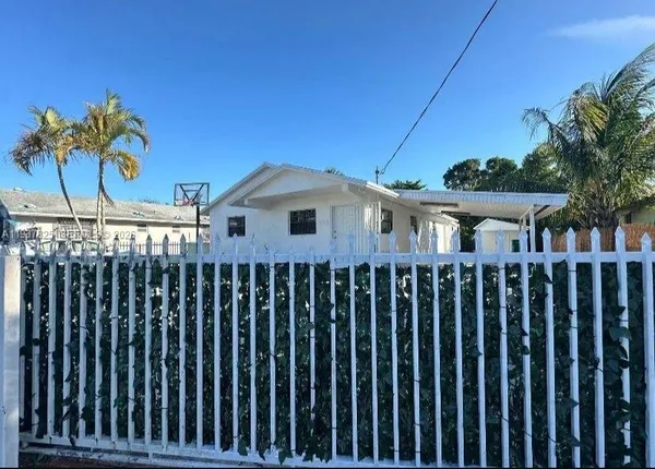 a view of a chairs with wooden fence