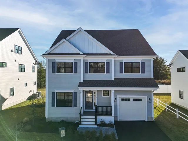a aerial view of a house with a yard