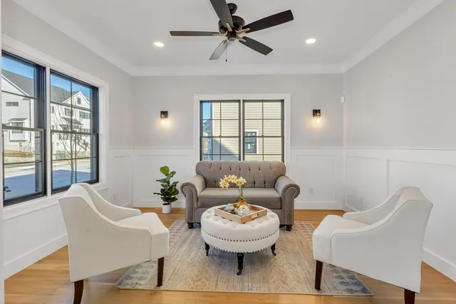 a bathroom with a granite countertop toilet sink and mirror