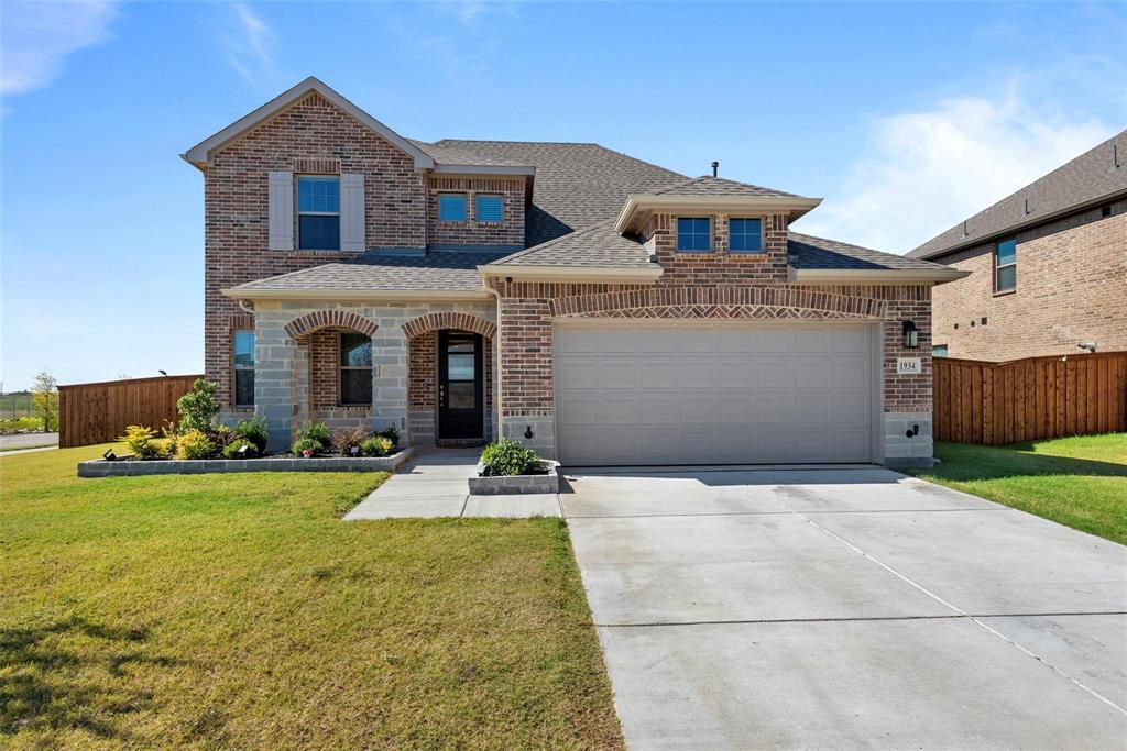 1934 Sand Spgs Street Forney, TX 75126 - Photo 1 of 1 a front view of a house with garden