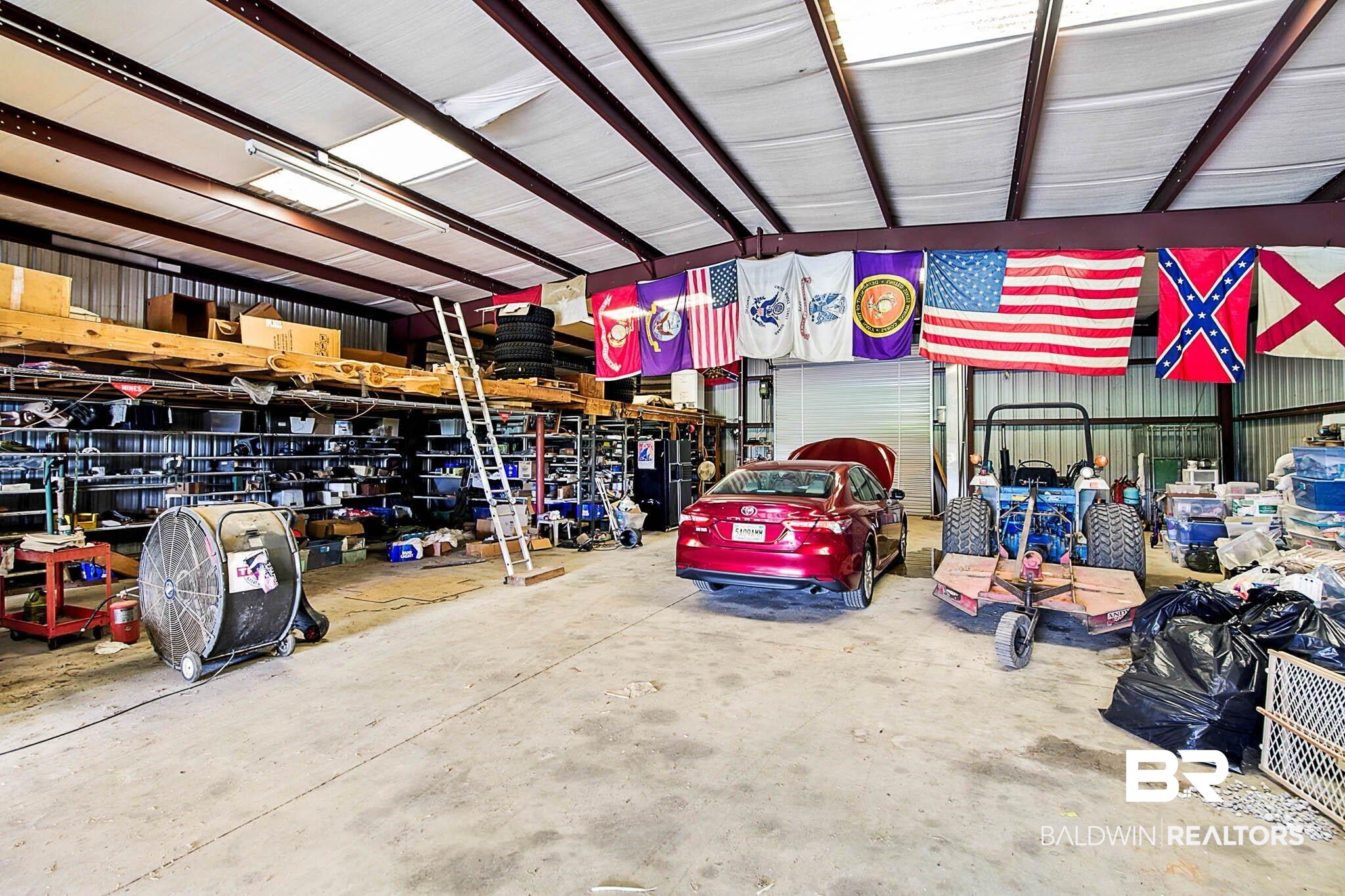 17270 Davis Road Summerdale, AL 36580 - Photo 70 of 97 Garage with metal wall