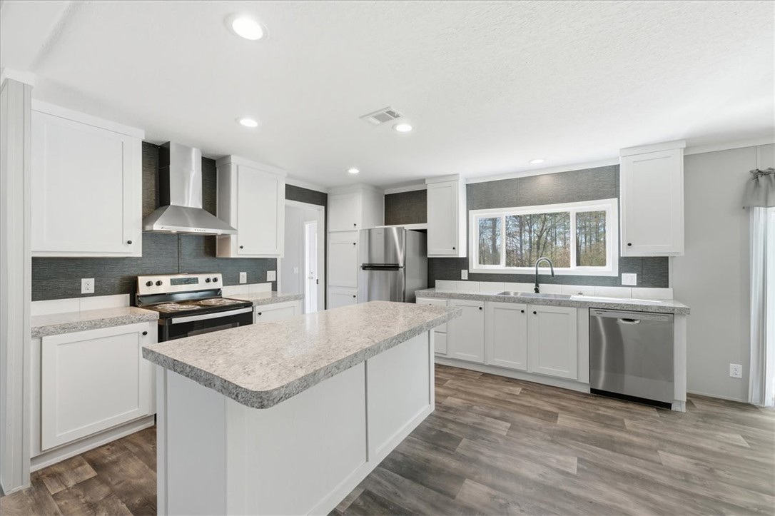 205 Union Court West Union, SC 29696 - Photo 6 of 28 This bright kitchen features an island, ample counter space, and modern appliances.