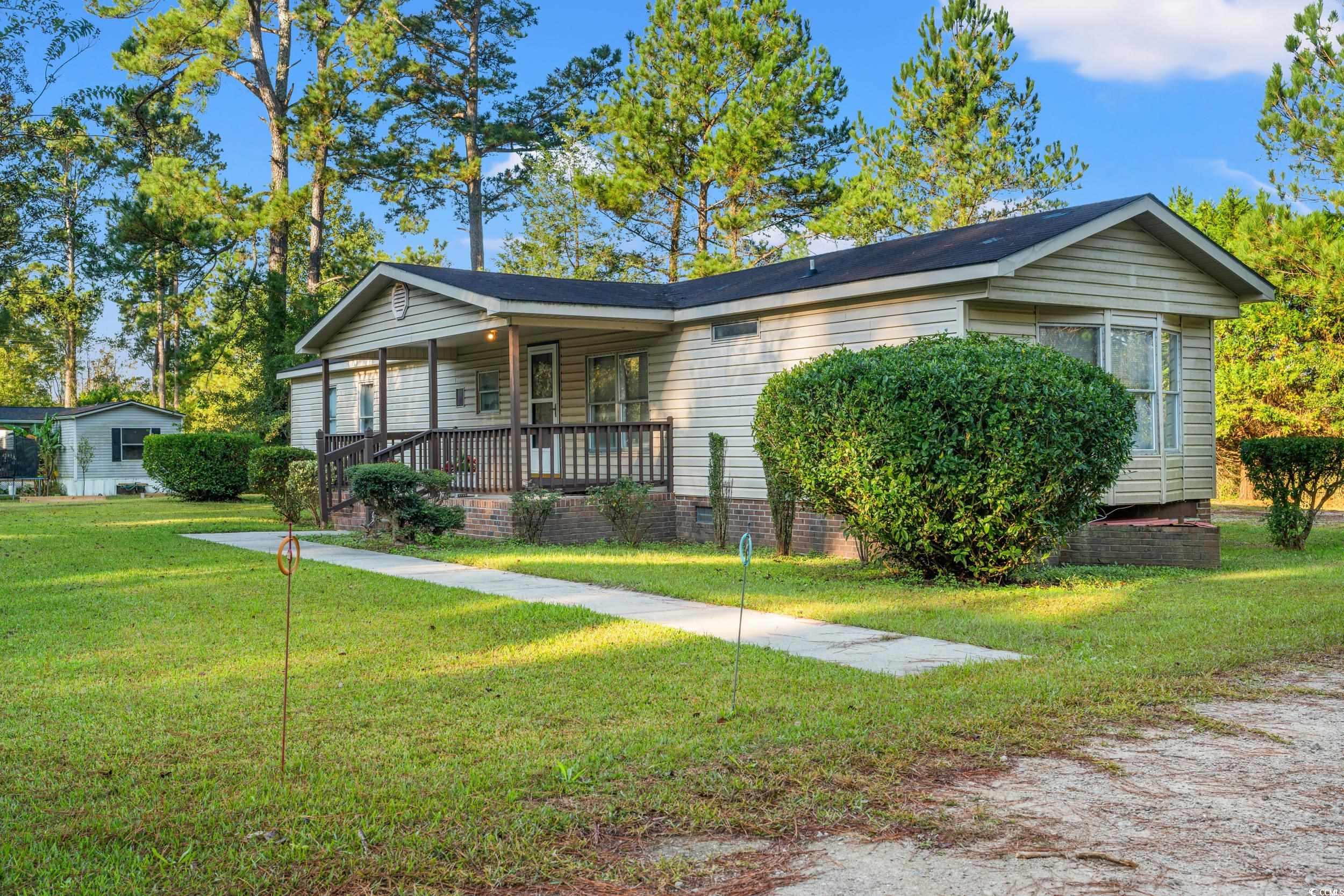 149 William Street Loris, SC 29569 - Photo 35 of 40 Ranch-style home featuring covered porch, a front lawn, and crawl space