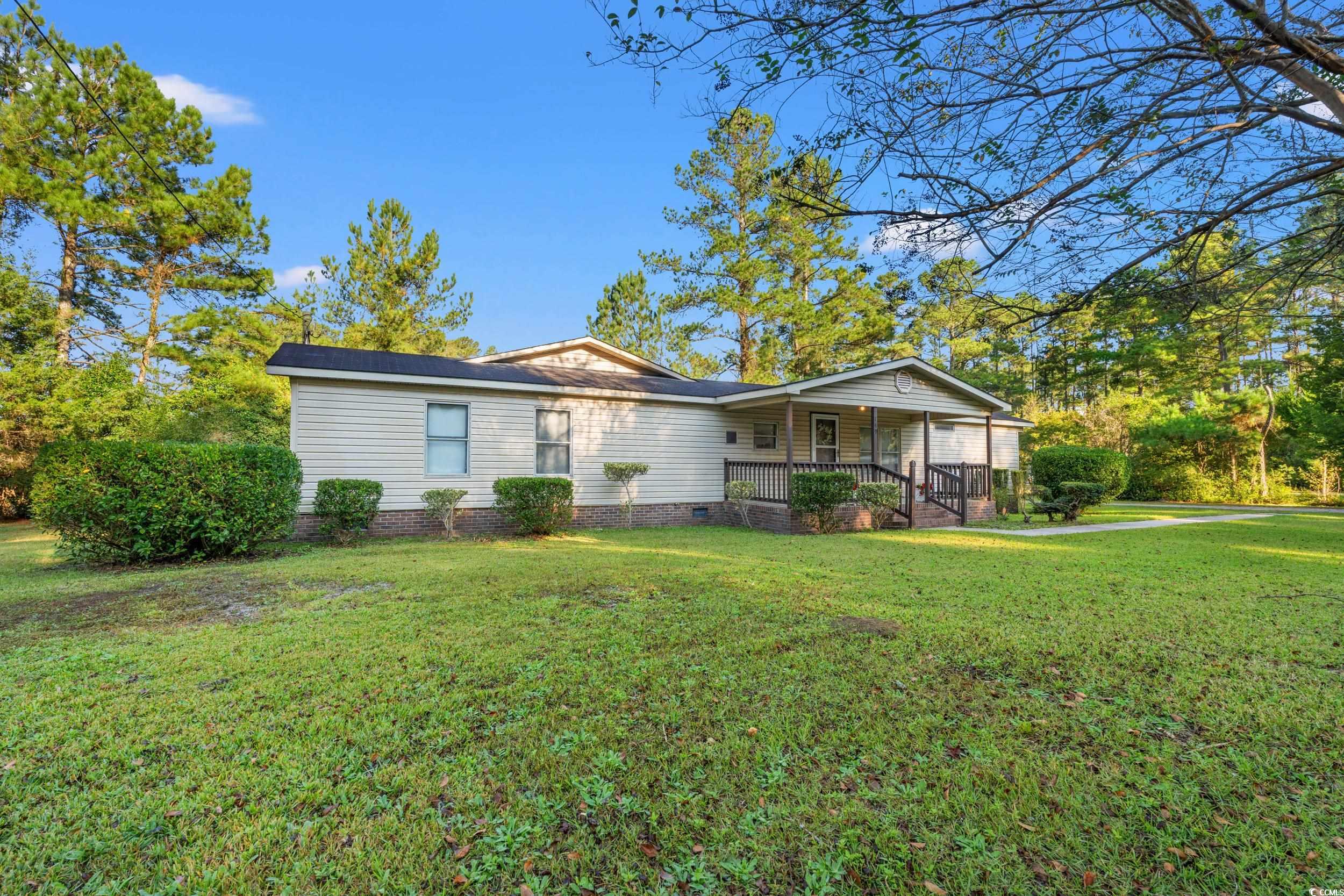 149 William Street Loris, SC 29569 - Photo 38 of 40 Ranch-style house featuring covered porch, a front lawn, and crawl space