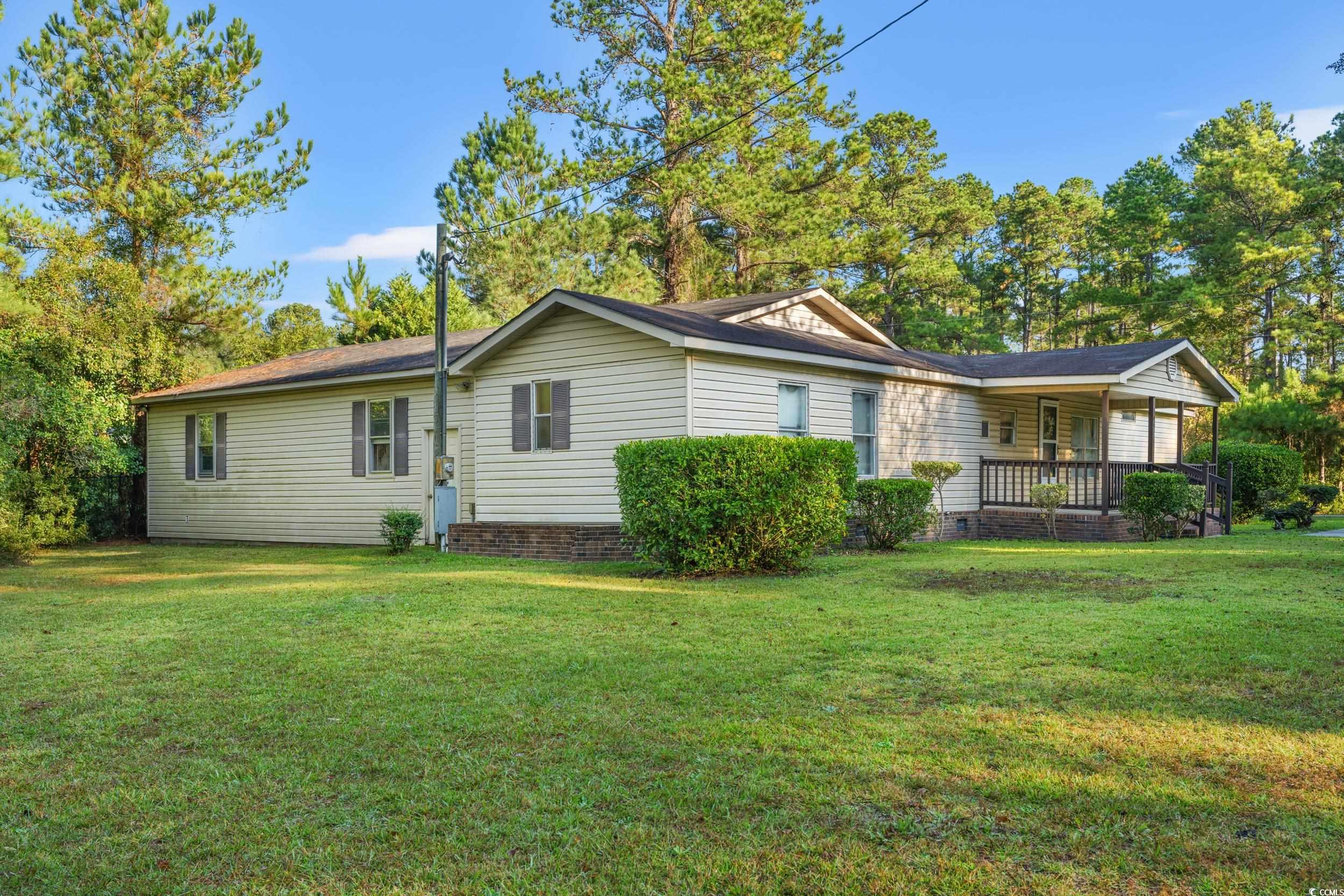 149 William Street Loris, SC 29569 - Photo 40 of 40 Back of property featuring a yard and a porch