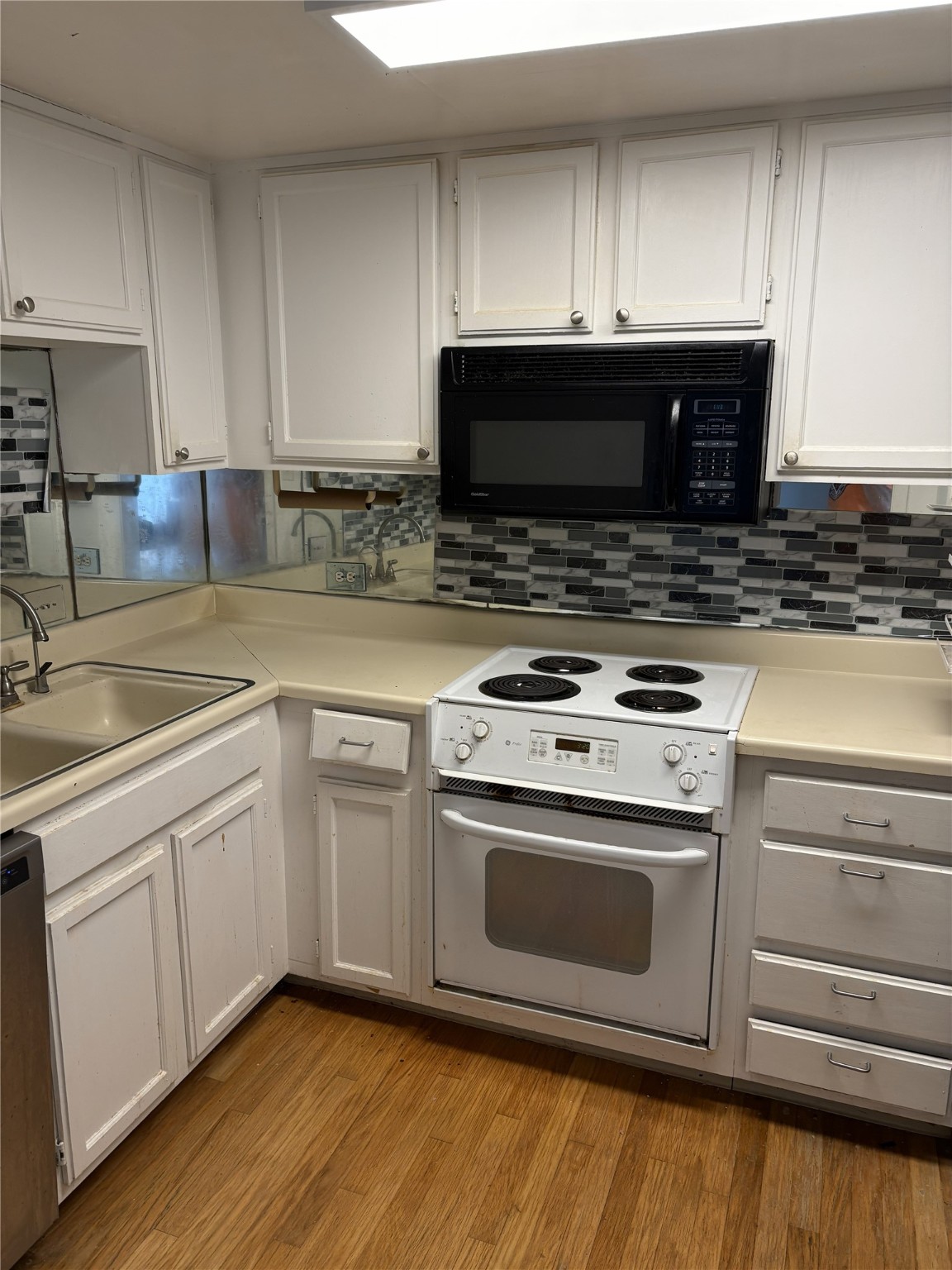 2016 Main Street, Unit 1620 Houston, TX 77002 - Photo 5 of 12 a kitchen with granite countertop a stove and a sink
