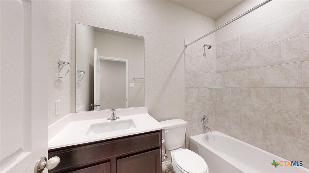 1111 Stone Vly Road Temple, TX 76502 - Photo 13 of 21 a bathroom with a sink toilet a mirror and shower