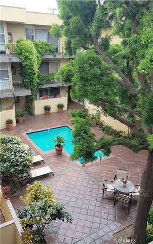 a house with lots of trees in the background