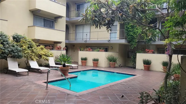 a view of a chairs and tables in the patio