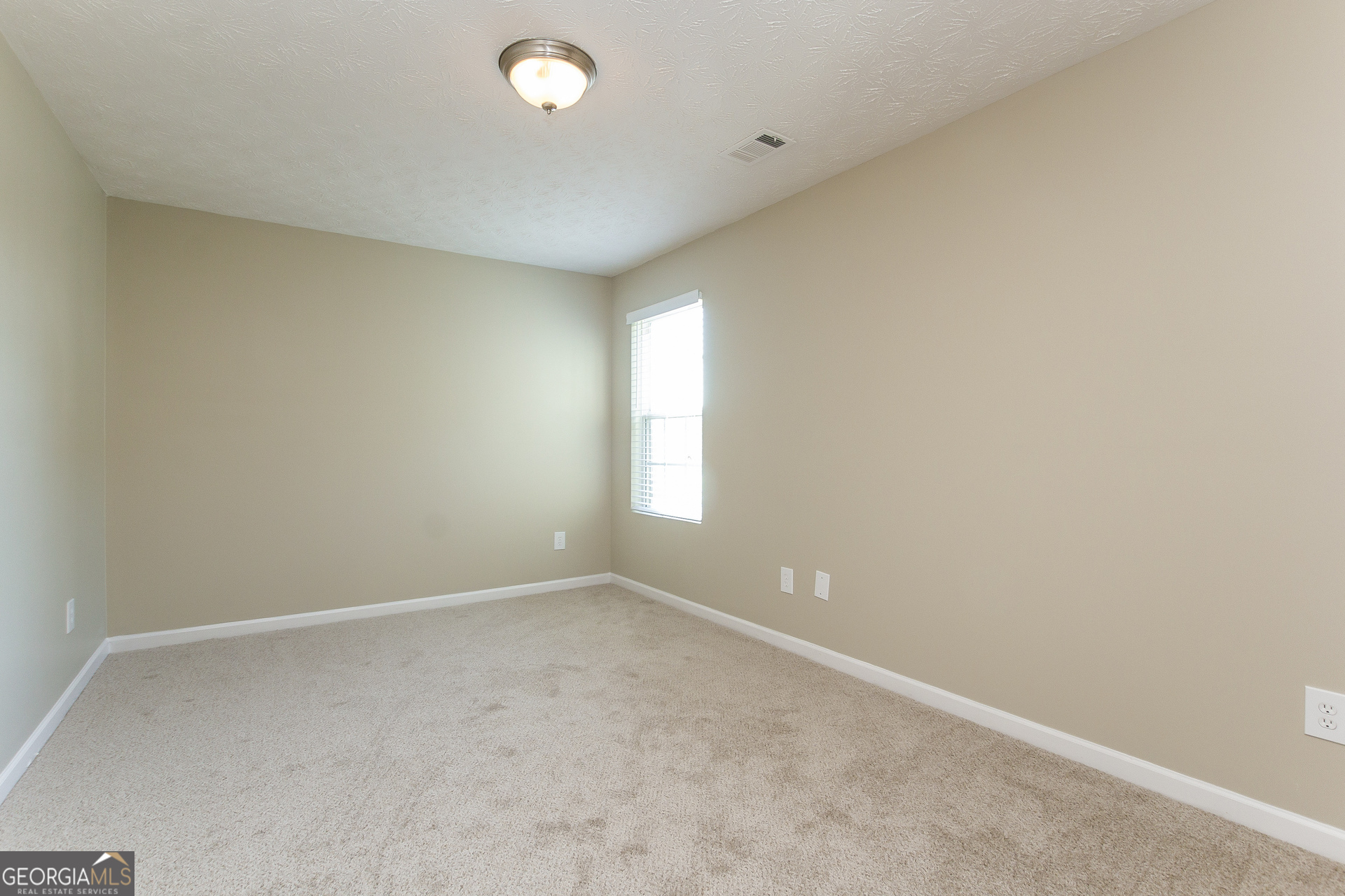 7287 Walton Hill Fairburn, GA 30213 - Photo 13 of 15 an empty room with windows and closet
