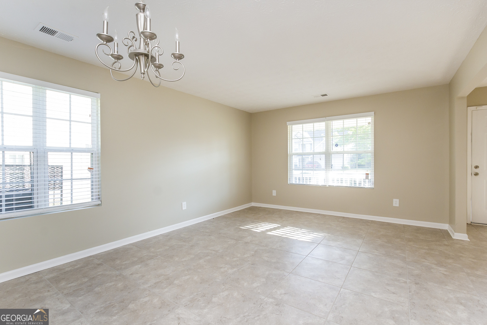 7287 Walton Hill Fairburn, GA 30213 - Photo 4 of 15 a view of an empty room with a window