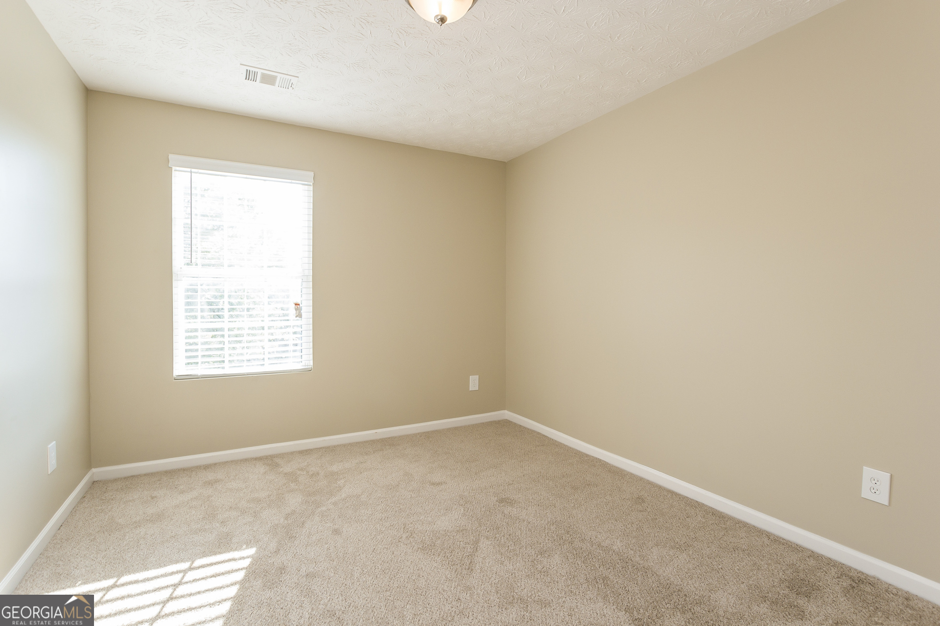 7287 Walton Hill Fairburn, GA 30213 - Photo 9 of 15 an empty room with a window