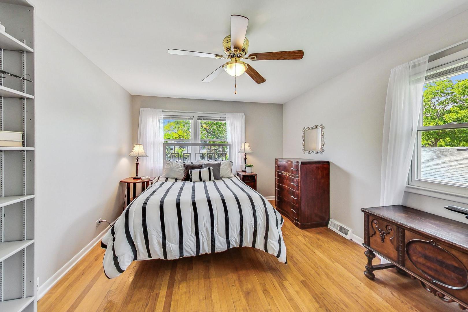 910 Whitegate Drive Mount Prospect, IL 60056 - Photo 27 of 38 a bed sitting in a bedroom next to a window