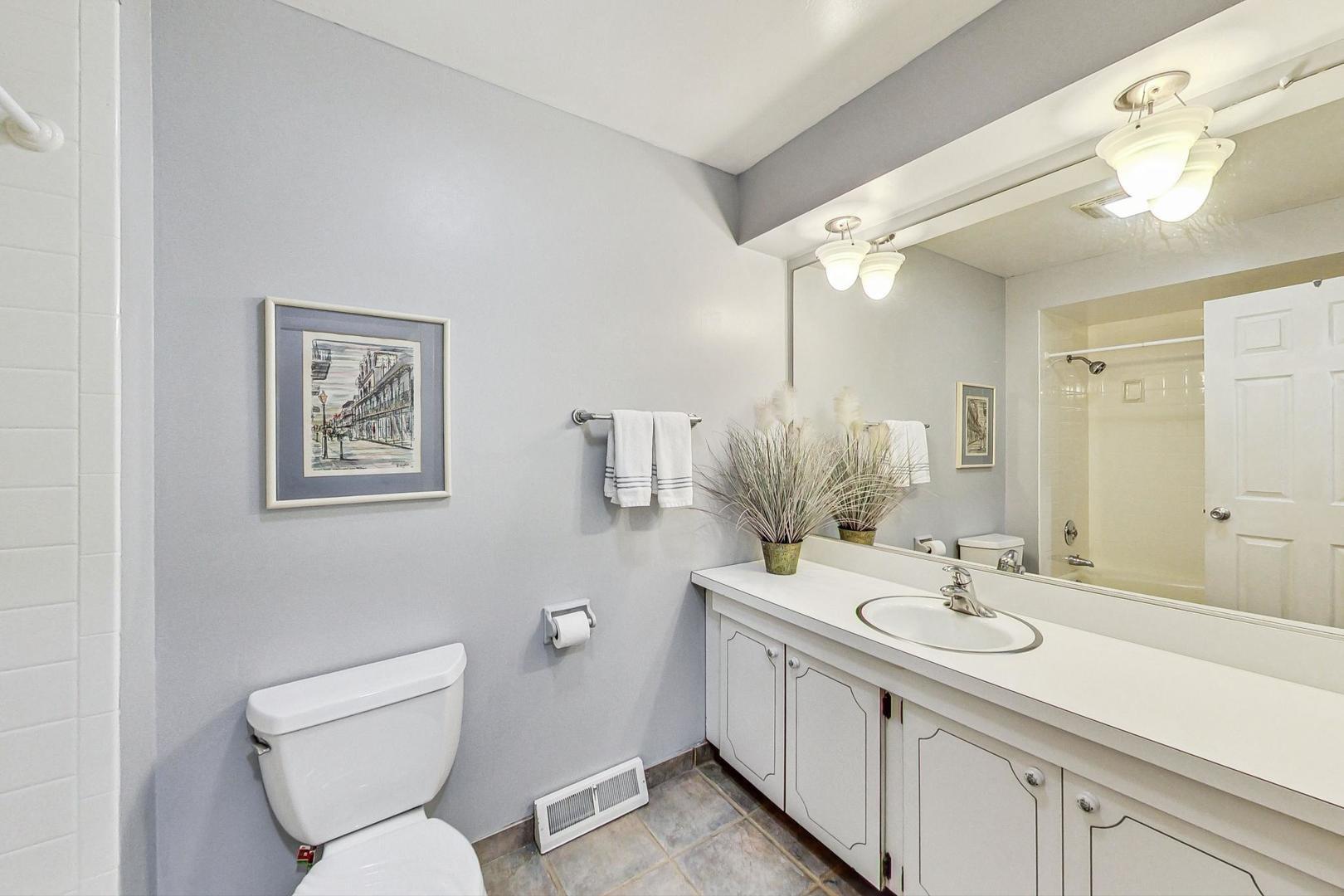 910 Whitegate Drive Mount Prospect, IL 60056 - Photo 30 of 38 a bathroom with a toilet sink and mirror