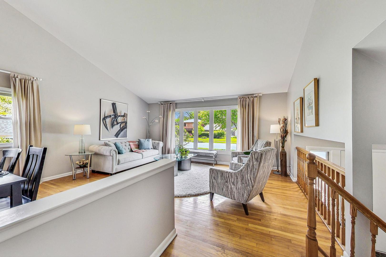 910 Whitegate Drive Mount Prospect, IL 60056 - Photo 6 of 38 a living room with furniture and a large window