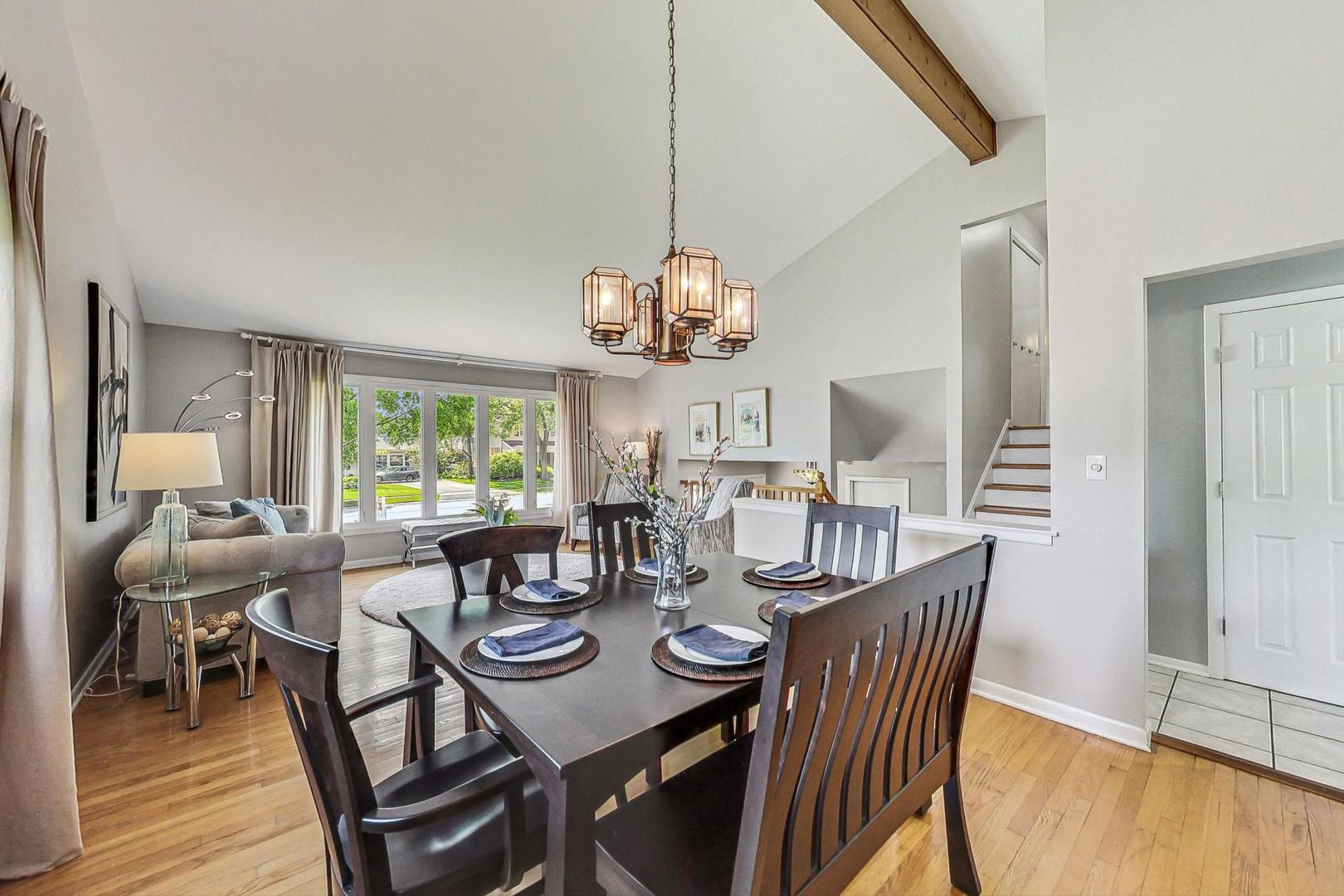 910 Whitegate Drive Mount Prospect, IL 60056 - Photo 10 of 38 a view of a dining room with furniture window and wooden floor