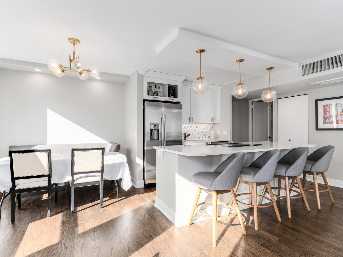 260 East Chestnut Street, Unit 1212 Chicago, IL 60611 - Photo 12 of 30 a kitchen with granite countertop counter top space and stainless steel appliances