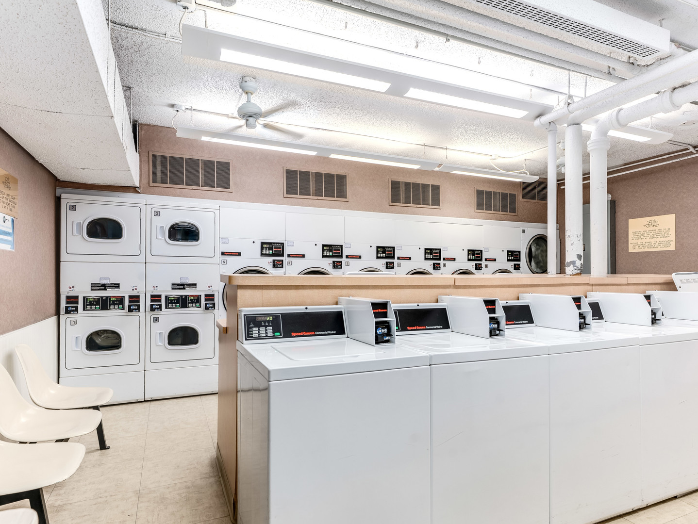 260 East Chestnut Street, Unit 1212 Chicago, IL 60611 - Photo 30 of 30 a utility room with stainless steel appliances washer and dryer