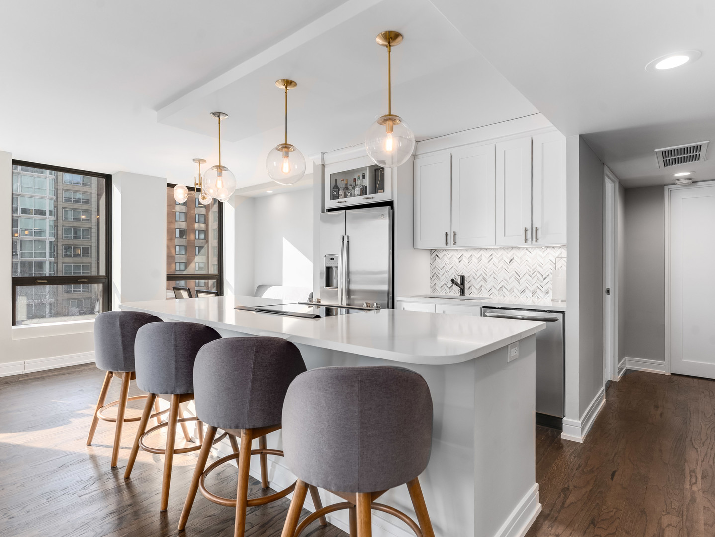 260 East Chestnut Street, Unit 1212 Chicago, IL 60611 - Photo 5 of 30 a view of kitchen with cabinets and wooden floor
