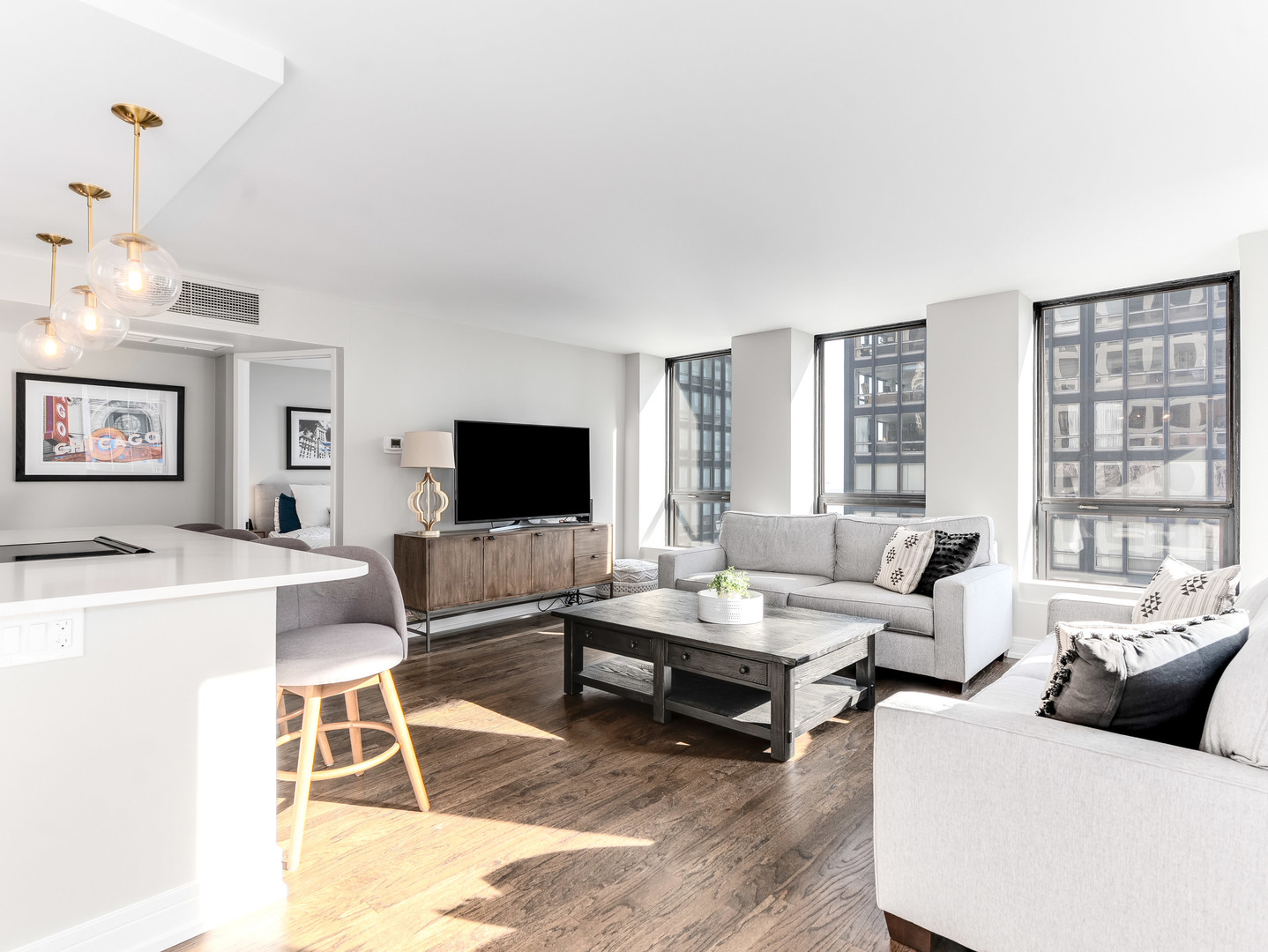 260 East Chestnut Street, Unit 1212 Chicago, IL 60611 - Photo 8 of 30 a living room with furniture and a flat screen tv