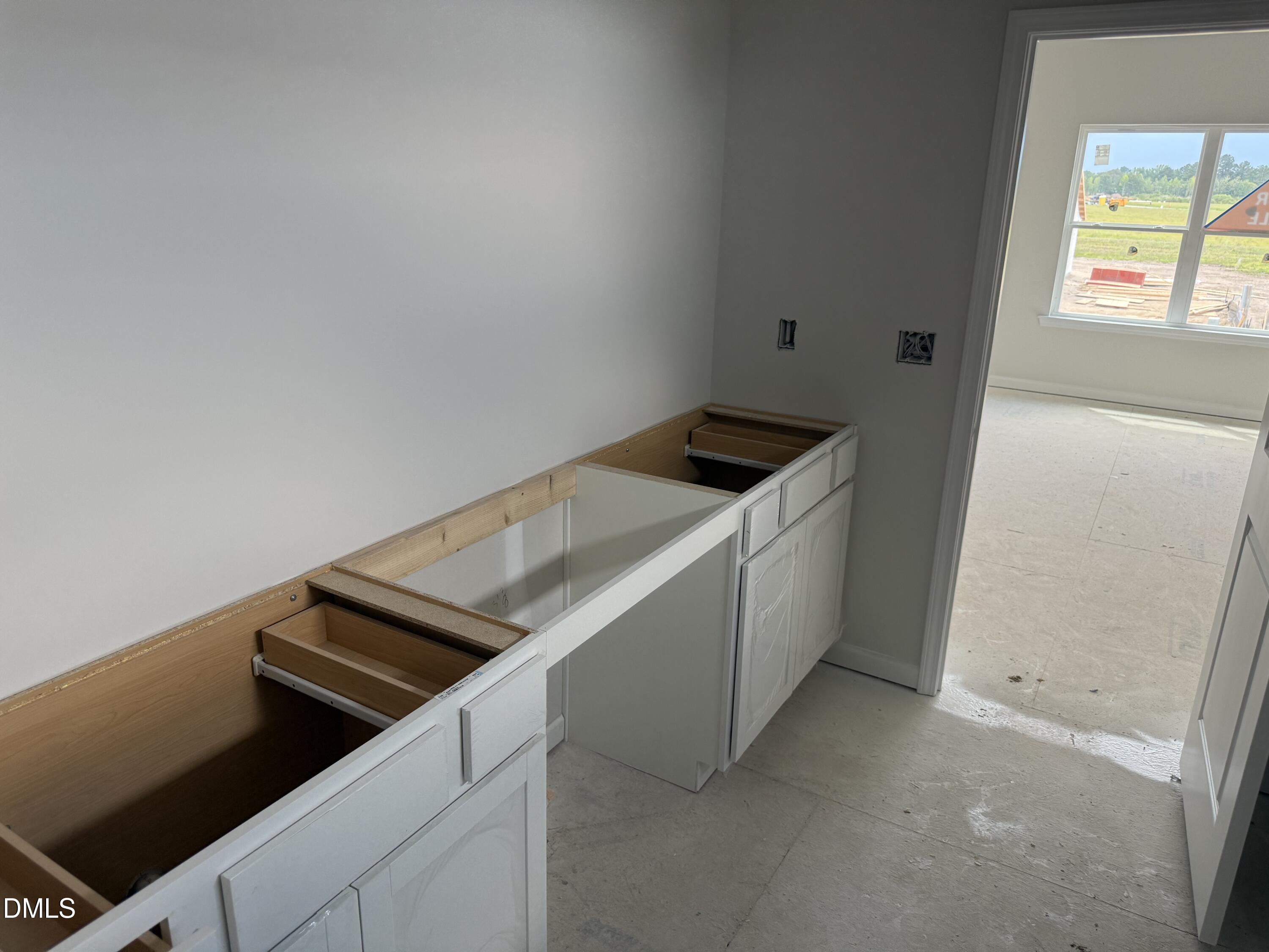 246 Spirit Spgs Road Smithfield, NC 27577 - Photo 5 of 38 a utility room with dryer and washer