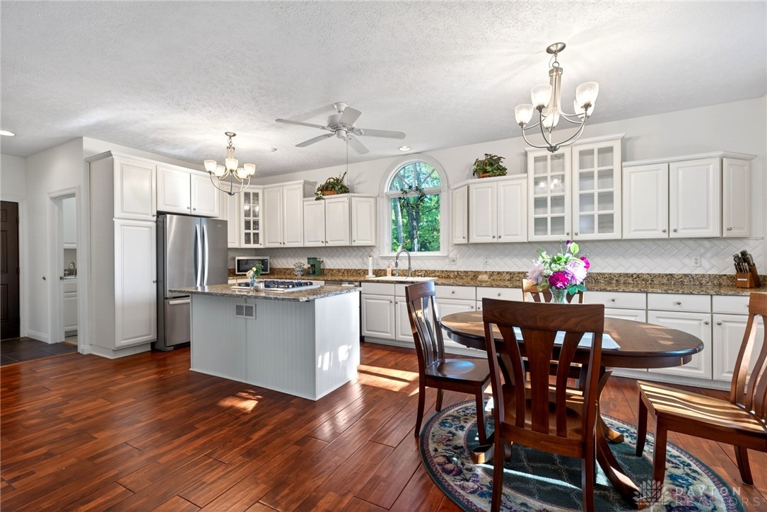 330 South Alpha Bellbrook Road Bellbrook, OH 45305 - Photo 27 of 87 This bright kitchen features ample counter space, rich wood flooring, and charming dining area.