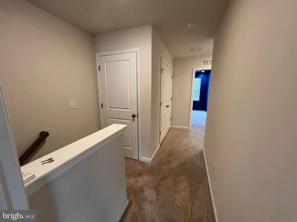 a view of hallway with stairs