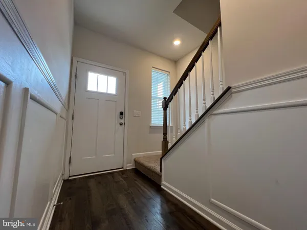 a view of entryway with wooden floor