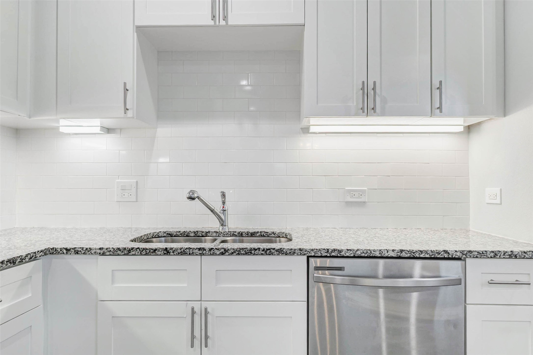 18835 Luminescent Ln Spring Spring, TX 77379 - Photo 11 of 28 a kitchen with granite countertop white cabinets and white appliances