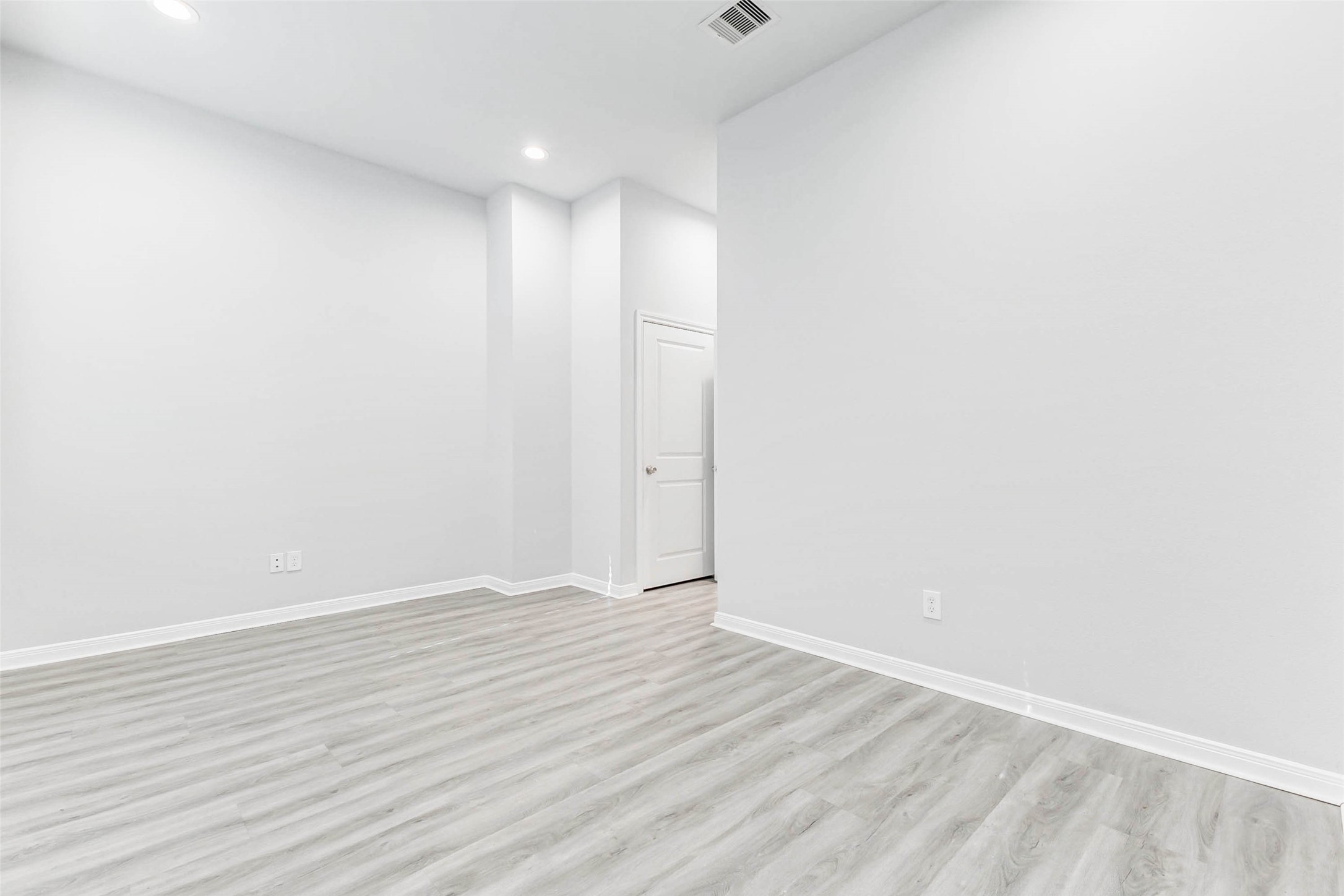 18835 Luminescent Ln Spring Spring, TX 77379 - Photo 13 of 28 a view of an empty room with wooden floor