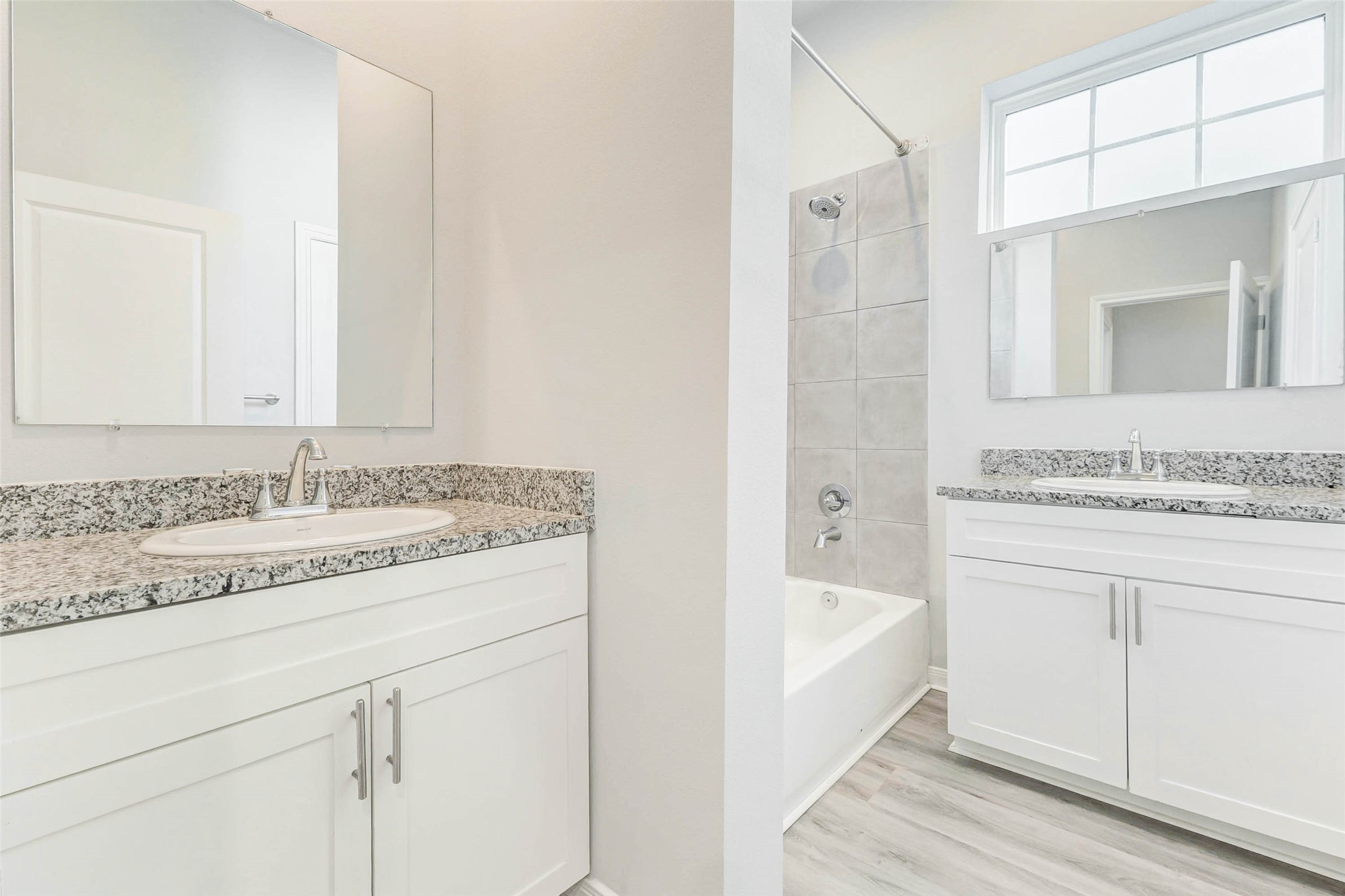 18835 Luminescent Ln Spring Spring, TX 77379 - Photo 22 of 28 a bathroom with a granite countertop sink and a bathtub