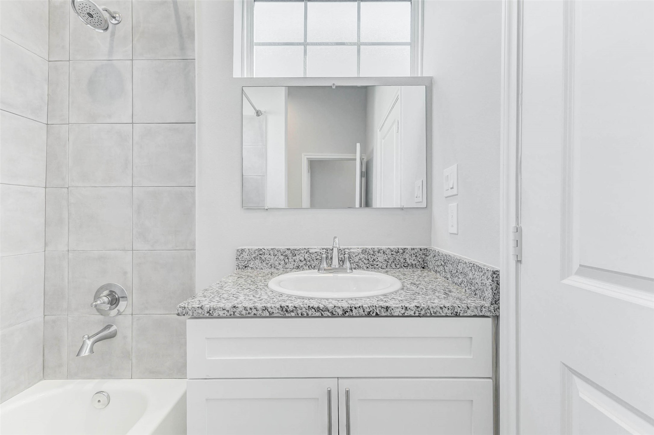 18835 Luminescent Ln Spring Spring, TX 77379 - Photo 23 of 28 a bathroom with a granite countertop sink and mirror