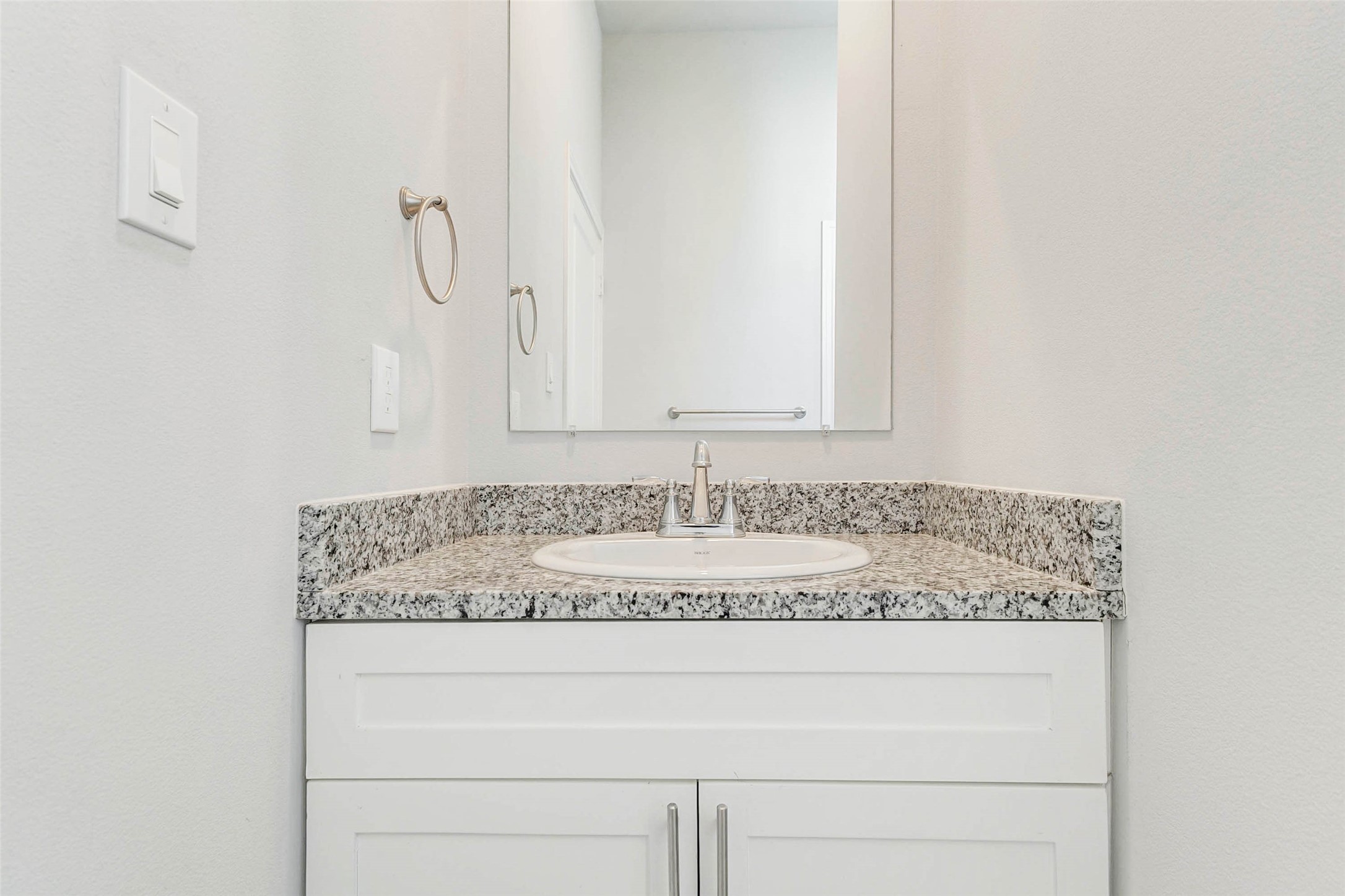 18835 Luminescent Ln Spring Spring, TX 77379 - Photo 24 of 28 a bathroom with a granite countertop sink and a mirror