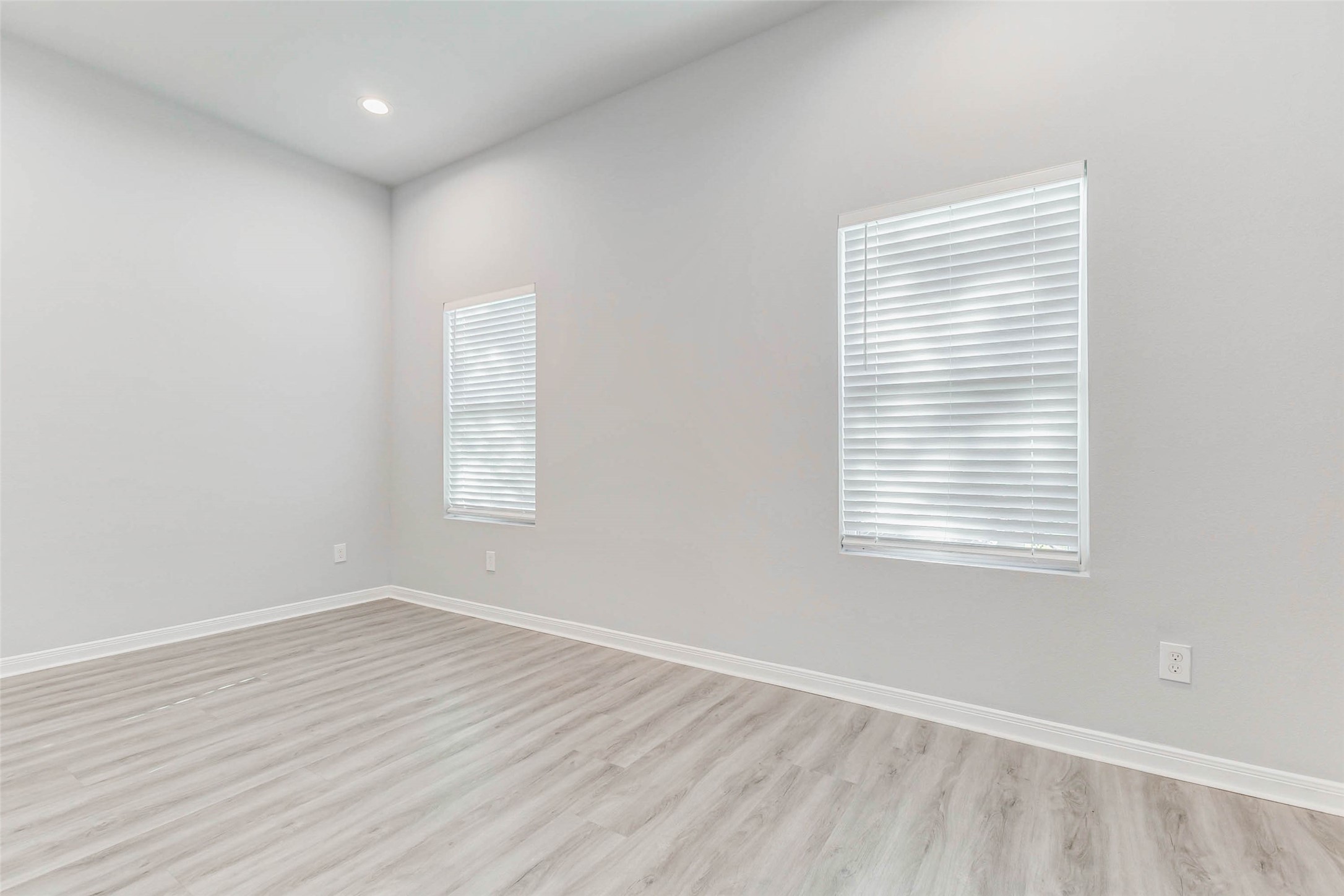 18835 Luminescent Ln Spring Spring, TX 77379 - Photo 8 of 28 an empty room with wooden floor and windows